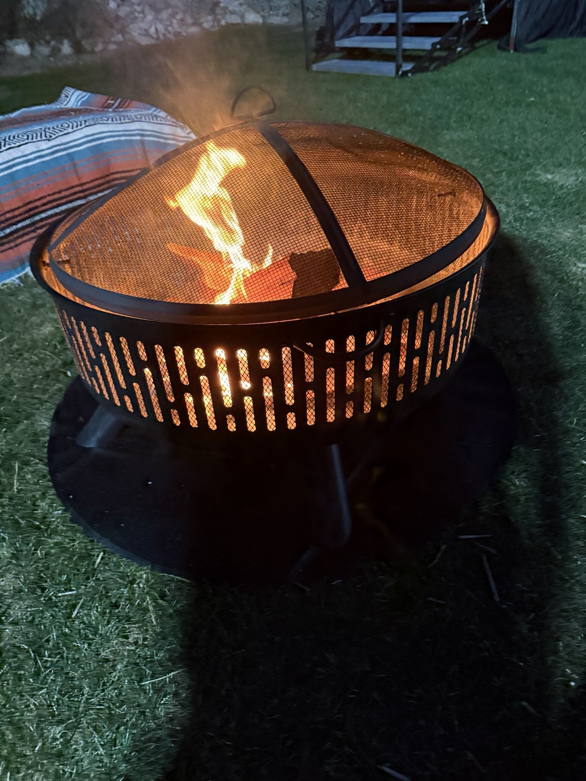 Fire pit burning on a lawn